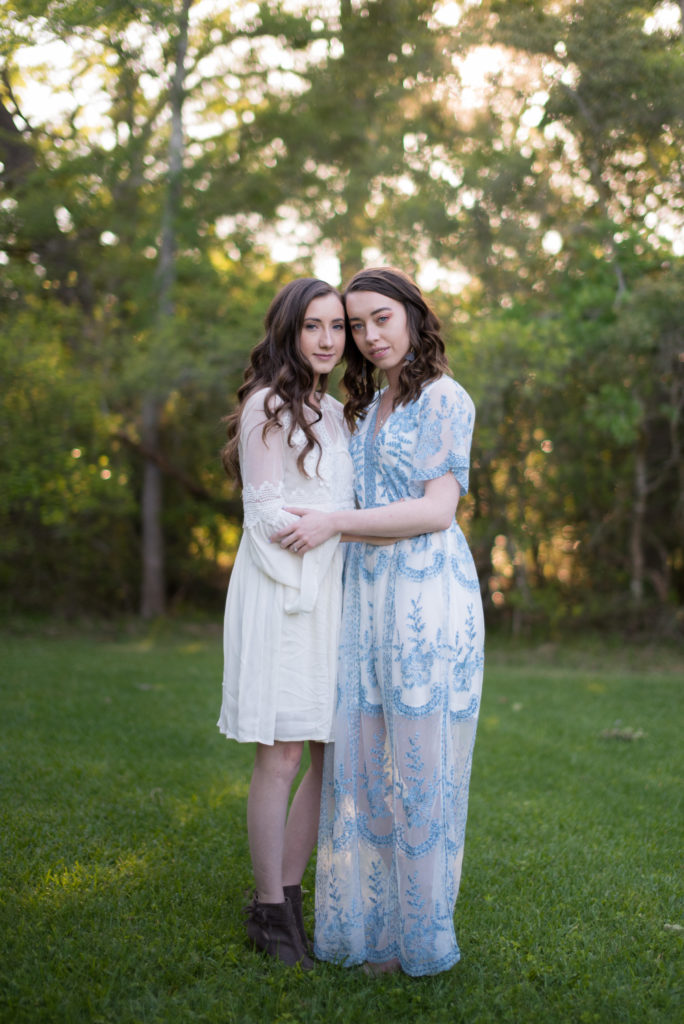 Same Sex Women engagement photo in Blue dress and white dress