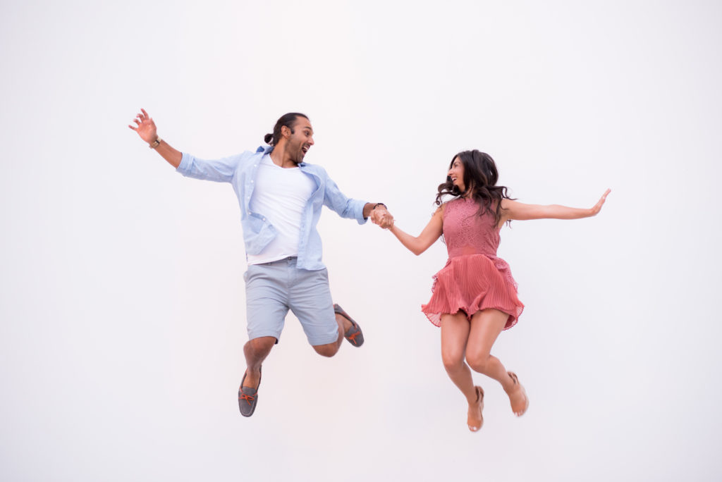 Houston Engagement - Bright fun jumping - What to wear for engagement photos