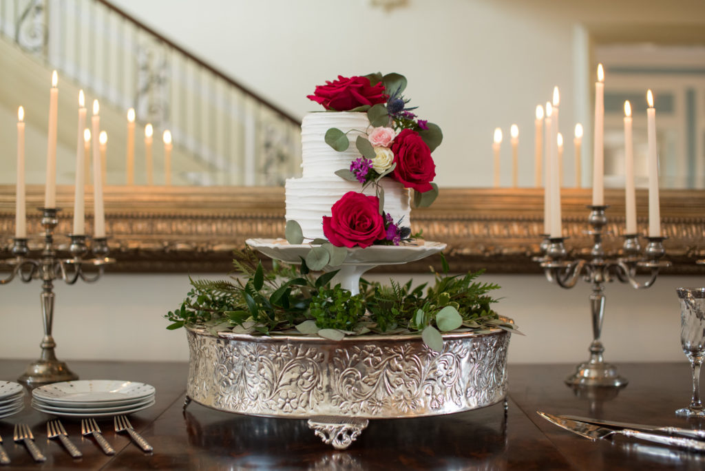delicious wedding cake and fancy flowers