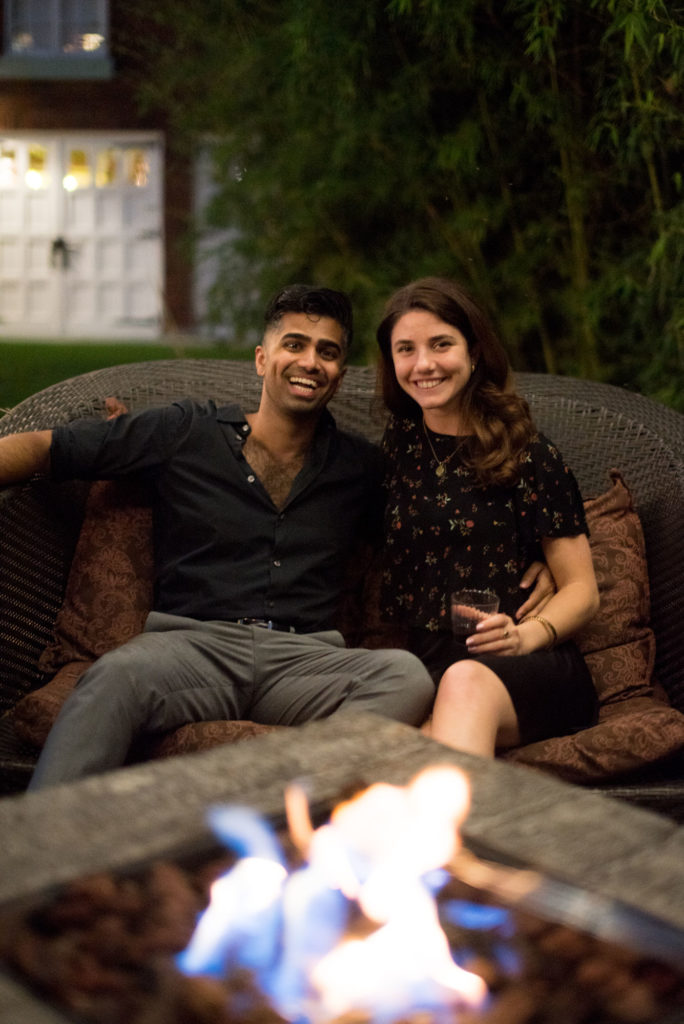 couple enjoying the heat by the fire pit