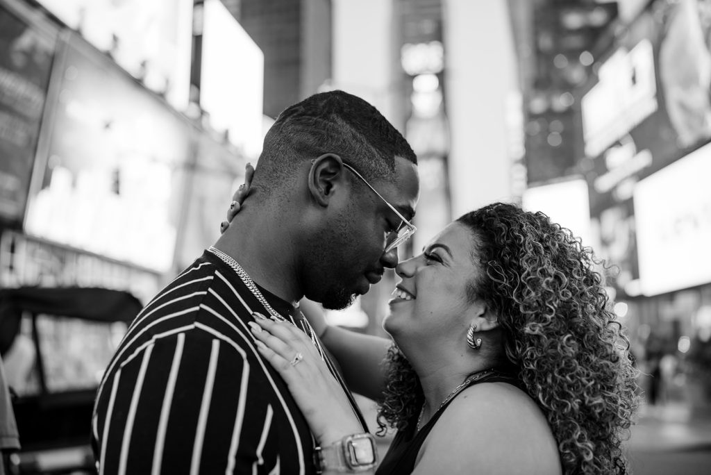 New York City couple in Time Square for photoshoot
