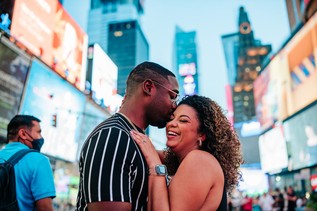 New York City couple in Time Square for photoshoot