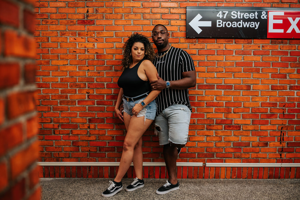 New York City couple in the subway during photoshoot