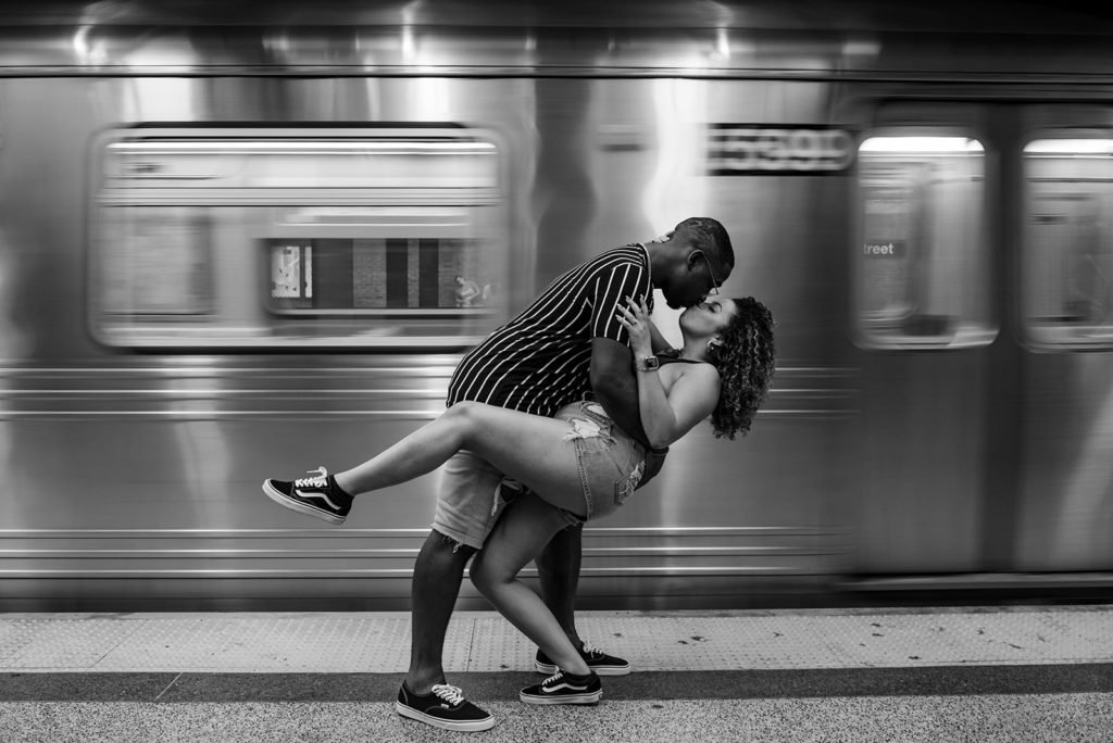New York City couple kissing in the subway during photoshoot