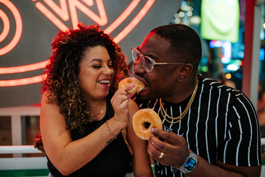 New York City couple eats Krispy Kream donuts during photoshoot